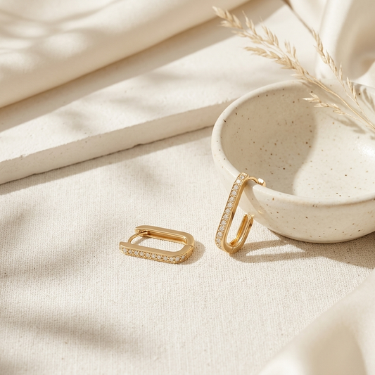 Gold Pave Rectangle Hoop Earrings held in hand close up