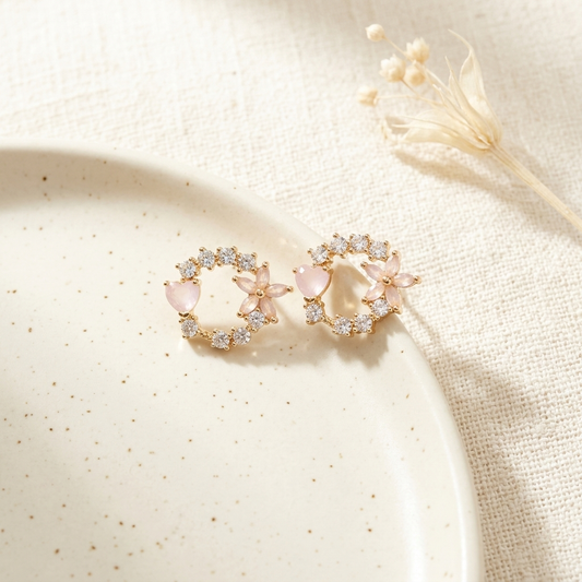 Pink Floral Crystal Circle Stud Earrings flat lay on plate