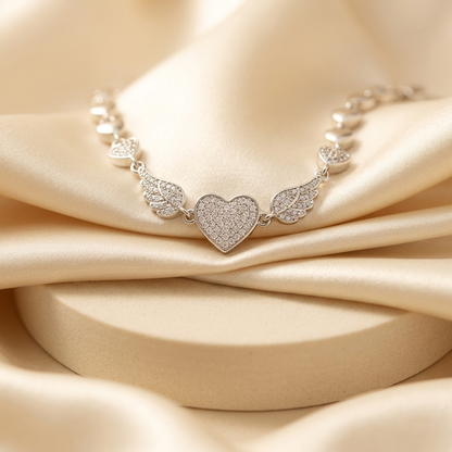 Silver Pave Angel Wing Heart Bracelet held in hand showing detail