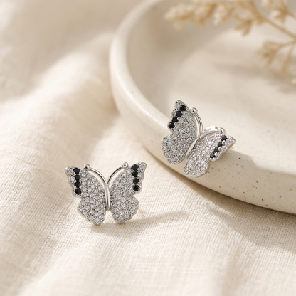 Silver Pave Butterfly Stud Earring held in hand close up