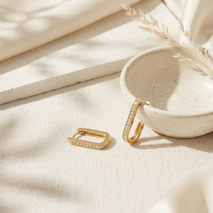 Gold Pave Rectangle Hoop Earrings held in hand close up