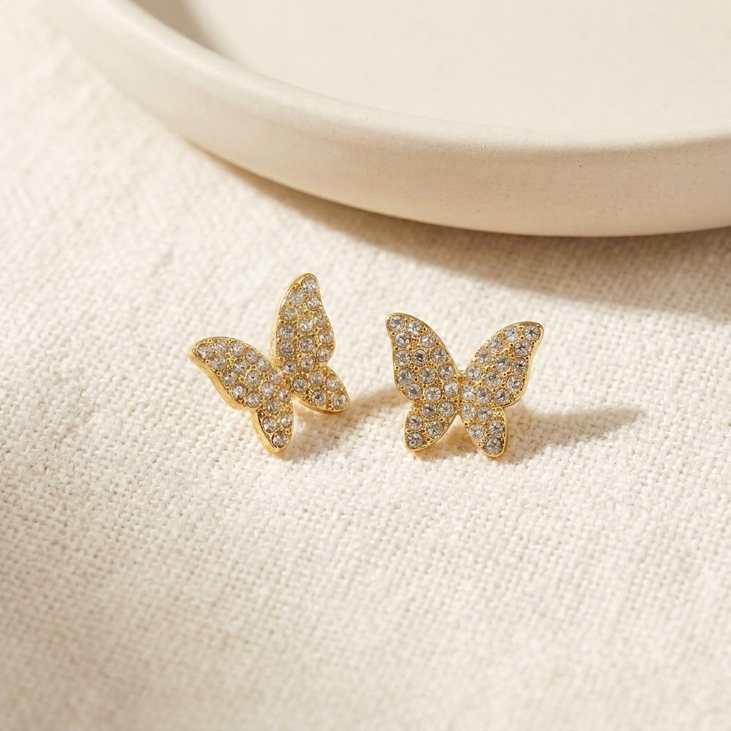 7-Day Gold Crystal Earrings Set – 4-Prong Crystal Stud in gold on cream fabric