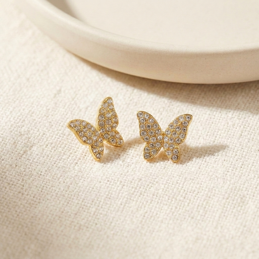 7-Day Gold Crystal Earrings Set – 4-Prong Crystal Stud in gold on cream fabric