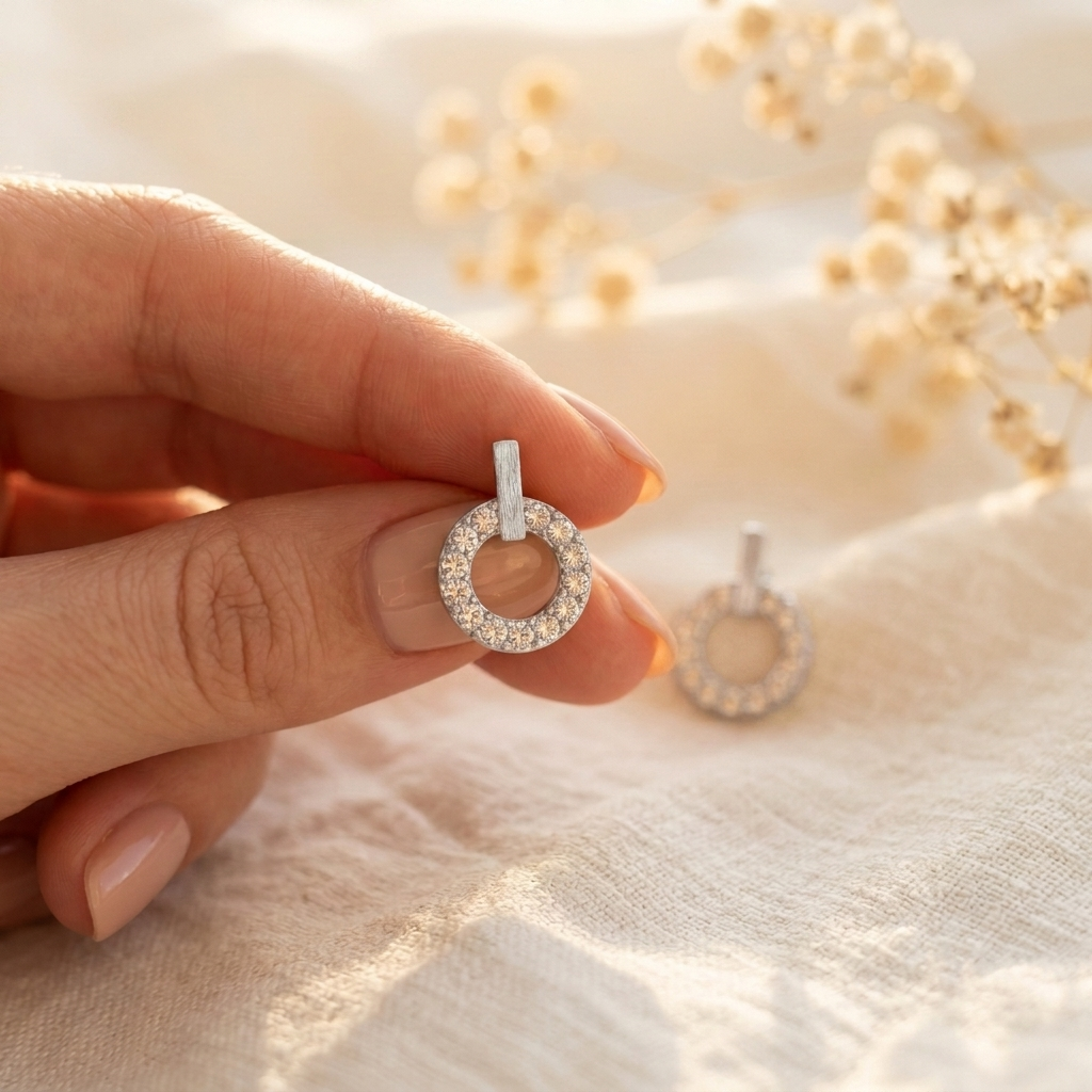 7 Days of Sparkle Silver Set – Starburst Pave Stud in silver held in hand