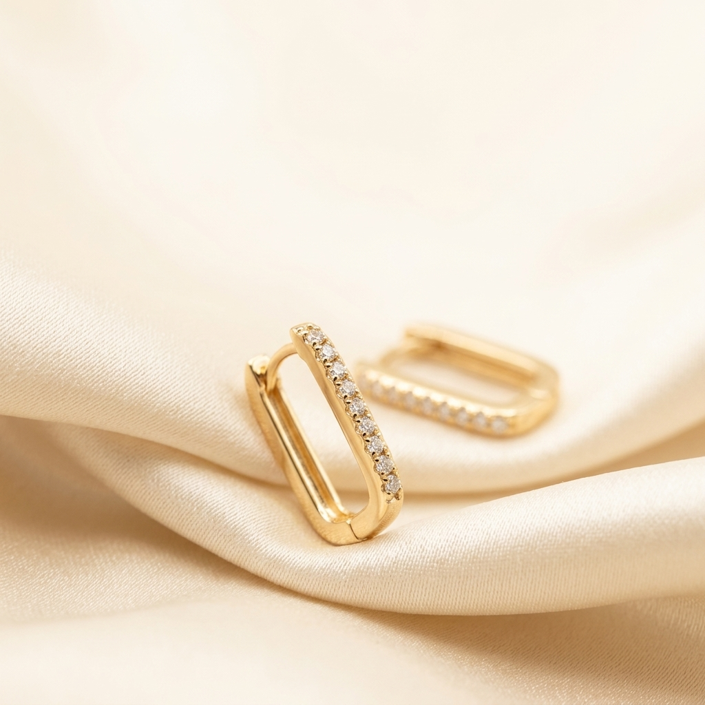 Gold Pave Rectangle Hoop Earrings flat lay on ceramic plate