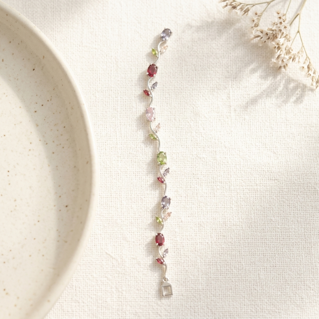 Silver Multi-Stone Crystal Vine Leaf Bracelet on ceramic dish