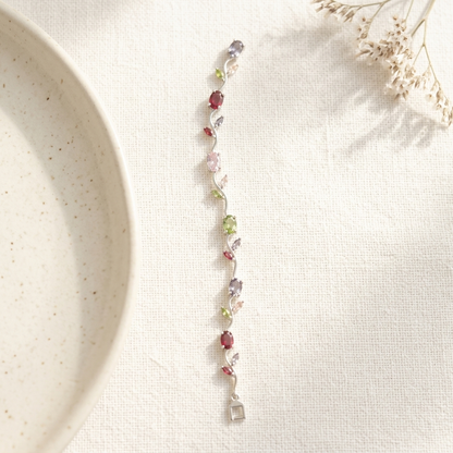 Silver Multi-Stone Crystal Vine Leaf Bracelet on ceramic dish