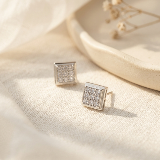 Silver Square Pave Crystal Stud Earrings flat lay on white linen