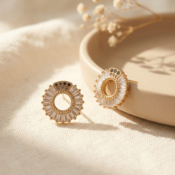 Gold Baguette Sunburst Circle Stud Earrings with black accent flat lay
