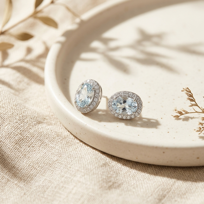 Silver Oval Halo Crystal Stud Earrings on ceramic tray with dried botanicals