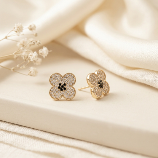 Gold Pave Four-Petal Flower Stud Earrings on cream silk with baby's breath